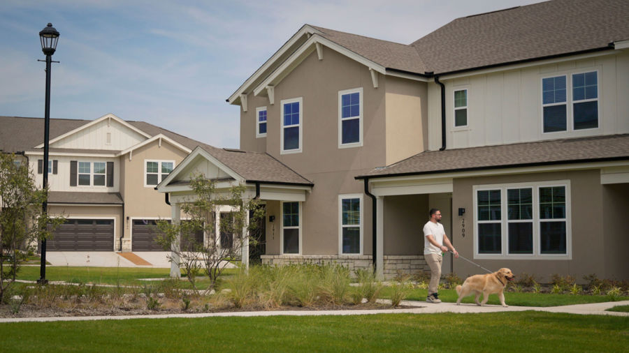 Rendering of open game lawn at HARMON Melissa with townhomes in the background